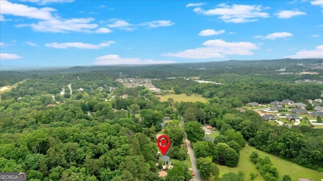 drone / aerial view of a heavily wooded area