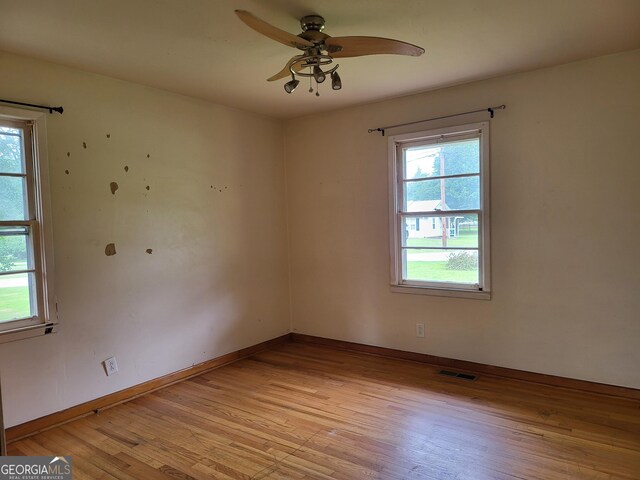 432 Northcrest Dr, Winder, GA 30680 - spare room with healthy amount of natural light, light wood finished floors, ceiling fan, and baseboards