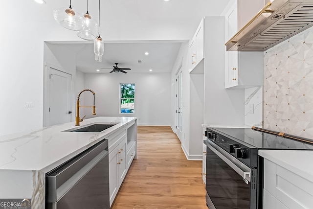 1835 Taylor Ave, East Point, GA 30344 - kitchen with dishwasher, electric range, under cabinet range hood, a sink, and white cabinetry
