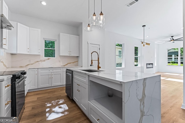 1835 Taylor Ave, East Point, GA 30344 - kitchen with a sink, black range with electric stovetop, plenty of natural light, and recessed lighting