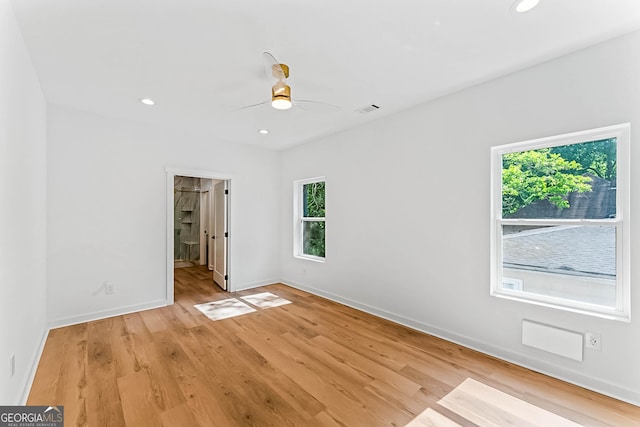 1835 Taylor Ave, East Point, GA 30344 - unfurnished bedroom with multiple windows, baseboards, light wood-style flooring, recessed lighting, and a ceiling fan