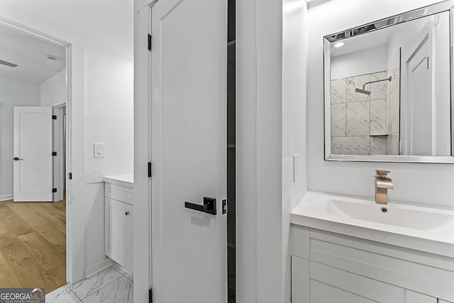 1835 Taylor Ave, East Point, GA 30344 - bathroom with vanity, a shower, marble finish flooring, and baseboards