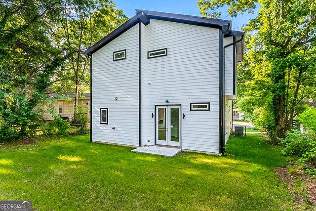1835 Taylor Ave, East Point, GA 30344 - back of property featuring french doors and a lawn