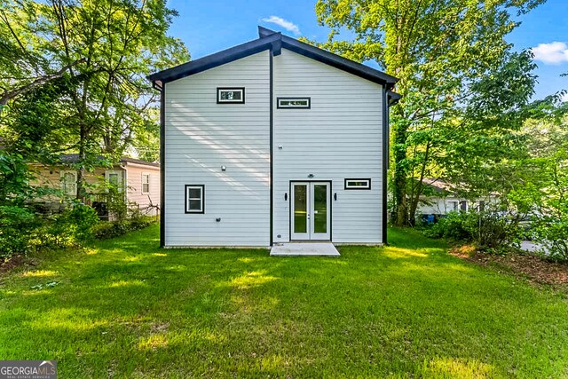 1835 Taylor Ave, East Point, GA 30344 - rear view of property featuring a yard and french doors