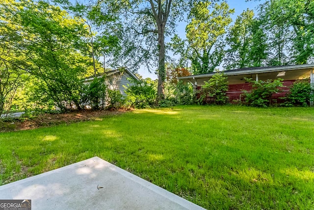 1835 Taylor Ave, East Point, GA 30344 - view of green lawn featuring a patio area
