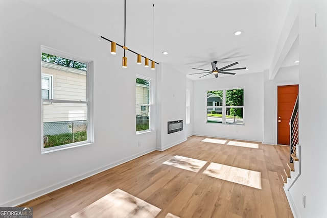 1835 Taylor Ave, East Point, GA 30344 - unfurnished living room with ceiling fan, light wood-style flooring, baseboards, recessed lighting, and a glass covered fireplace
