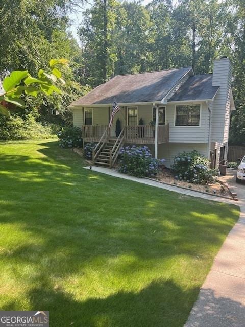 1221 Martin Nash Rd SW, Lilburn, GA 30047 - view of front of property with covered porch, a chimney, a front yard, and stairs