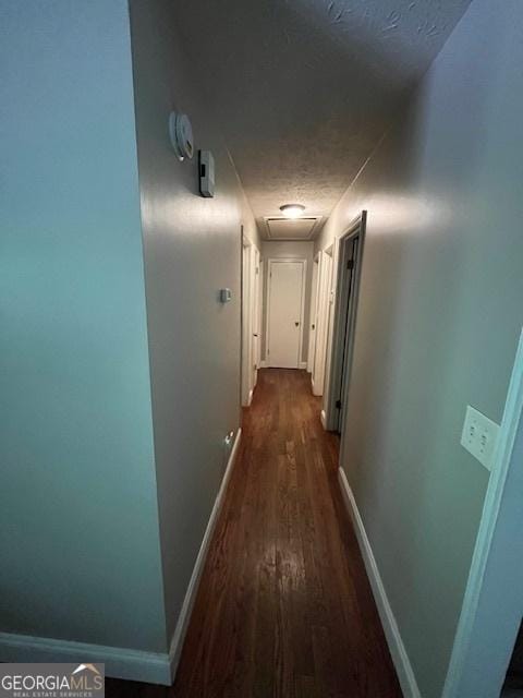 1221 Martin Nash Rd SW, Lilburn, GA 30047 - hallway with dark wood-style flooring and baseboards