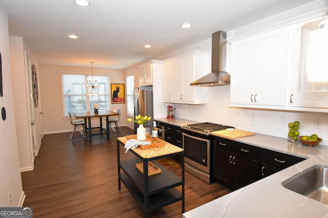 756 Cady Way, Atlanta, GA 30312 - kitchen featuring wall chimney range hood, stainless steel appliances, dark cabinets, white cabinetry, and recessed lighting