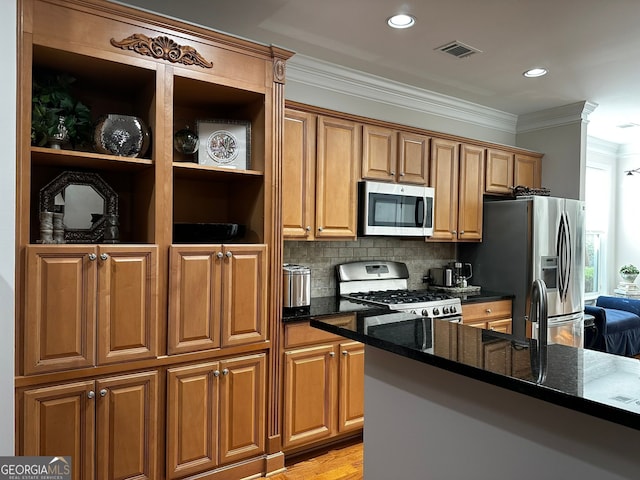 3127 White Magnolia Chase SW, Gainesville, GA 30504 - kitchen featuring stainless steel appliances, crown molding, dark stone countertops, brown cabinetry, and recessed lighting