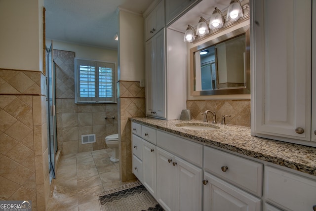 12 Riverview Rd SE, Rome, GA 30161 - full bath featuring tile walls, toilet, a tile shower, crown molding, and vanity