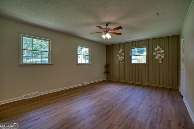 12 Riverview Rd SE, Rome, GA 30161 - unfurnished room with plenty of natural light, ceiling fan, a textured ceiling, dark wood-style flooring, and baseboards
