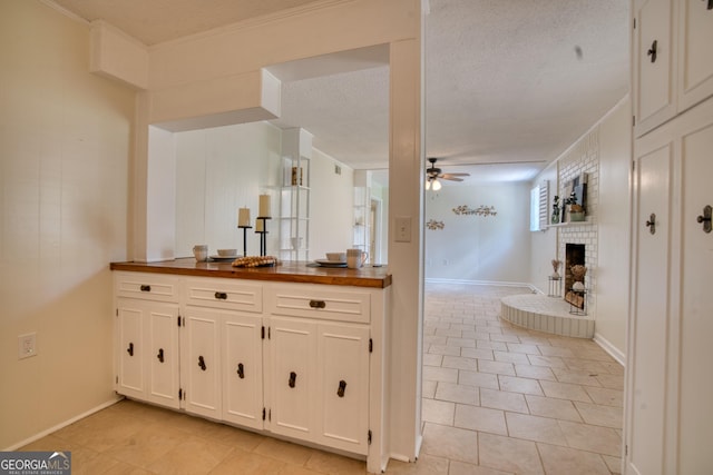 12 Riverview Rd SE, Rome, GA 30161 - bathroom with a brick fireplace, ceiling fan, tile patterned flooring, and vanity