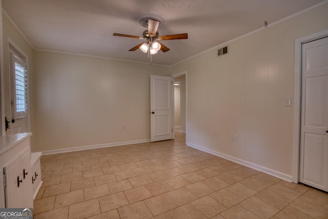 12 Riverview Rd SE, Rome, GA 30161 - spare room featuring ceiling fan, ornamental molding, light tile patterned floors, and baseboards