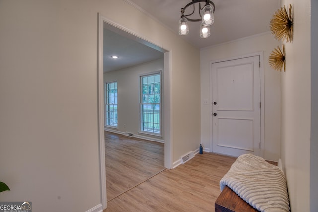 12 Riverview Rd SE, Rome, GA 30161 - foyer entrance featuring crown molding, light wood-type flooring, baseboards, and a chandelier
