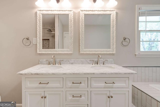 full bathroom with double vanity, tiled shower, and a bath