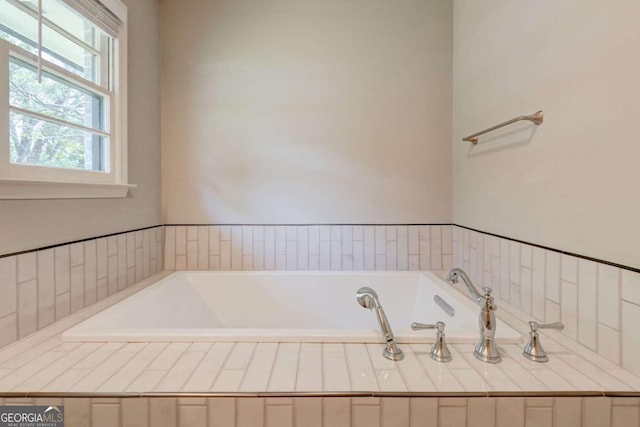 bathroom featuring a garden tub