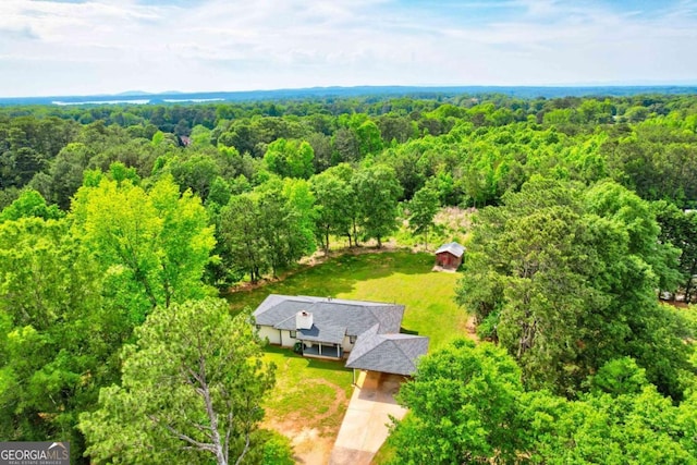 view of subject property featuring a forest