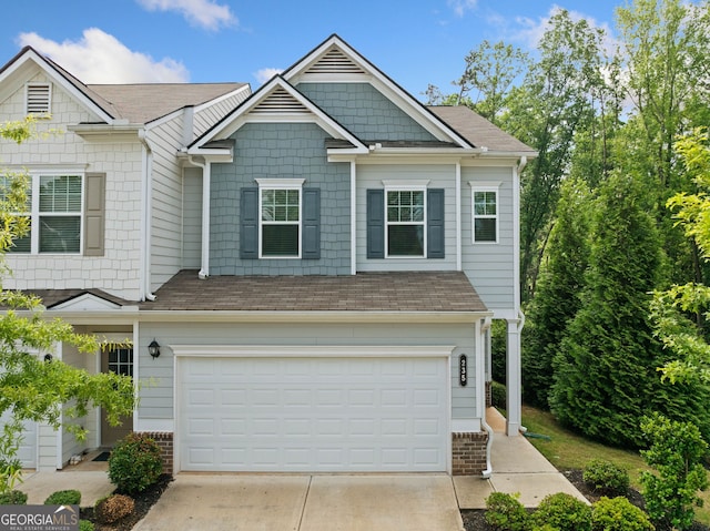 235 Centennial Cir, Canton, GA 30114 - view of front facade featuring driveway and an attached garage