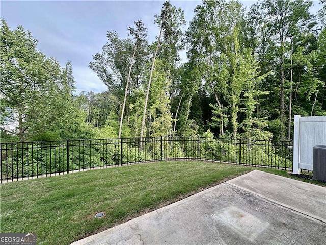 view of yard featuring a patio area and central AC unit
