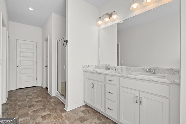 235 Centennial Cir, Canton, GA 30114 - full bath featuring double vanity, a shower stall, stone finish flooring, and baseboards