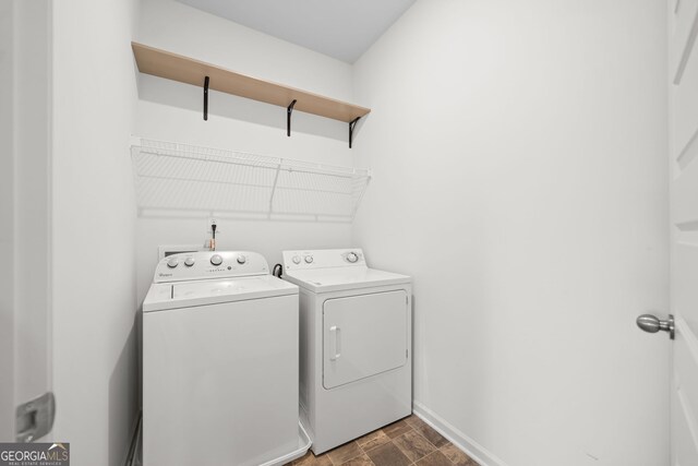 235 Centennial Cir, Canton, GA 30114 - laundry room featuring washing machine and clothes dryer, baseboards, and stone finish floors