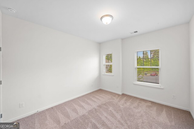 235 Centennial Cir, Canton, GA 30114 - unfurnished room with carpet floors and baseboards