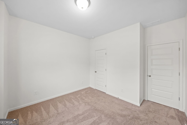 235 Centennial Cir, Canton, GA 30114 - unfurnished bedroom with carpet flooring, baseboards, and a closet
