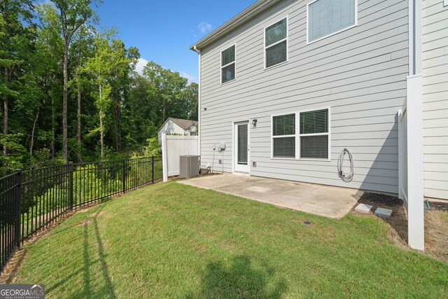 235 Centennial Cir, Canton, GA 30114 - back of property with a patio and central AC unit