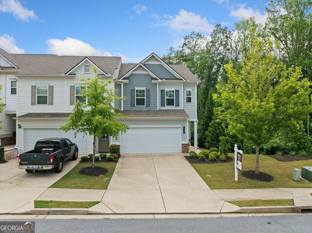235 Centennial Cir, Canton, GA 30114 - view of front of house featuring a garage, driveway, and a front lawn