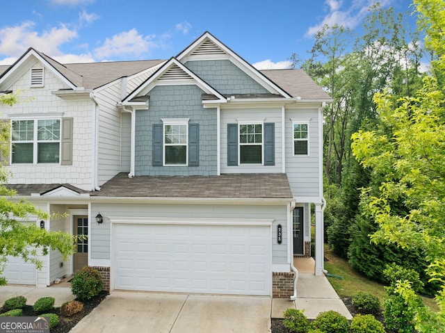 235 Centennial Cir, Canton, GA 30114 - view of front facade with concrete driveway, an attached garage, and a shingled roof