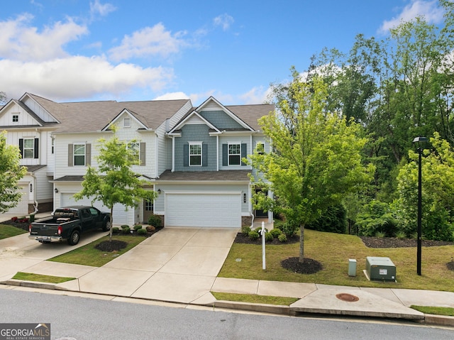 235 Centennial Cir, Canton, GA 30114 - view of front of home with driveway, a garage, a front lawn, and board and batten siding