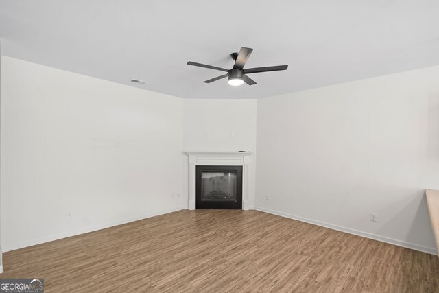 235 Centennial Cir, Canton, GA 30114 - half bathroom featuring wood finished floors, toilet, and baseboards