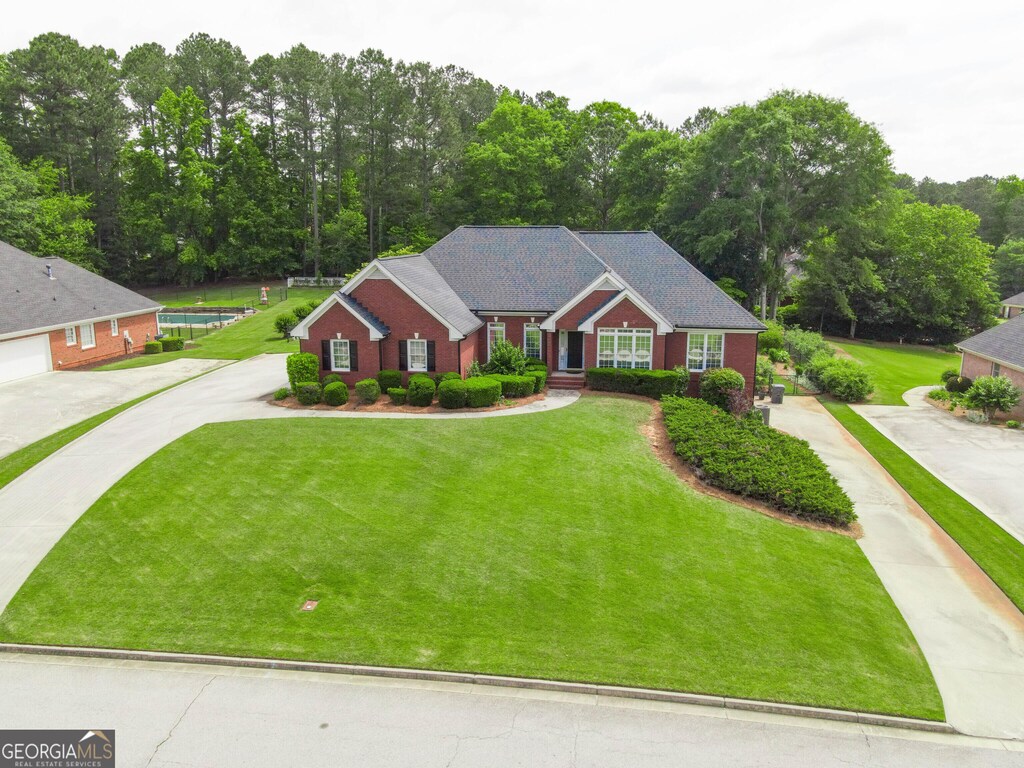 811 Ivy Ridge Dr, Loganville, GA 30052 - view of front facade with a front lawn and driveway