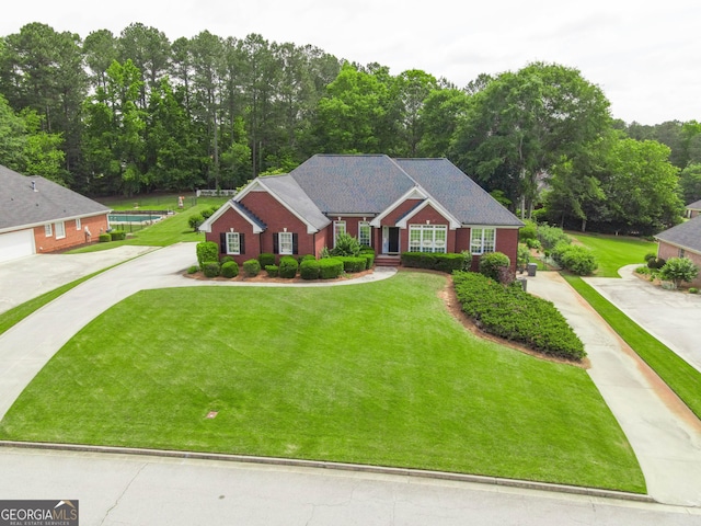 811 Ivy Ridge Dr, Loganville, GA 30052 - view of front facade with a front lawn and driveway