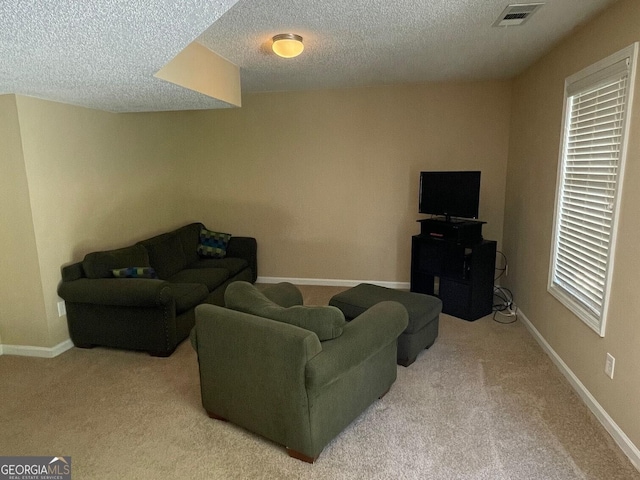 397 E Sycamore Dr, Winder, GA 30680 - living area with carpet flooring, a textured ceiling, and baseboards