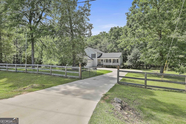 109 Cannon Rd, Sharpsburg, GA 30277 - view of front facade with driveway and a view of trees