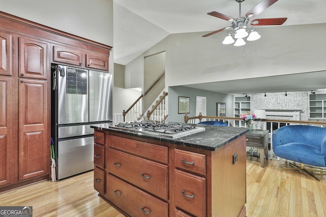109 Cannon Rd, Sharpsburg, GA 30277 - kitchen with appliances with stainless steel finishes, light wood-style floors, ceiling fan, vaulted ceiling, and open floor plan