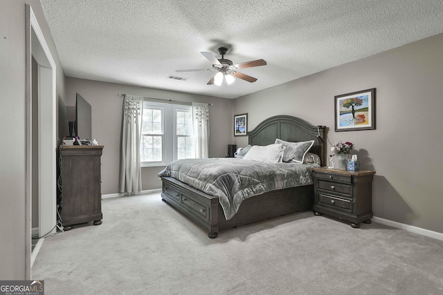 109 Cannon Rd, Sharpsburg, GA 30277 - bedroom featuring carpet floors, a textured ceiling, baseboards, and a ceiling fan