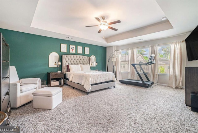 450 Rockfern Ct, Lilburn, GA 30047 - carpeted bedroom with a raised ceiling and a ceiling fan