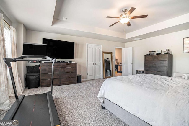 450 Rockfern Ct, Lilburn, GA 30047 - carpeted bedroom with a tray ceiling, baseboards, and a ceiling fan