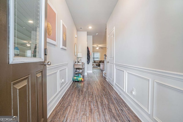 450 Rockfern Ct, Lilburn, GA 30047 - hall featuring a decorative wall, dark wood-style floors, a wainscoted wall, and recessed lighting