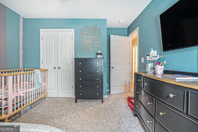 450 Rockfern Ct, Lilburn, GA 30047 - bedroom with a closet and light colored carpet