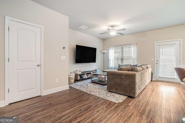 450 Rockfern Ct, Lilburn, GA 30047 - living room featuring wood finished floors, a ceiling fan, and baseboards