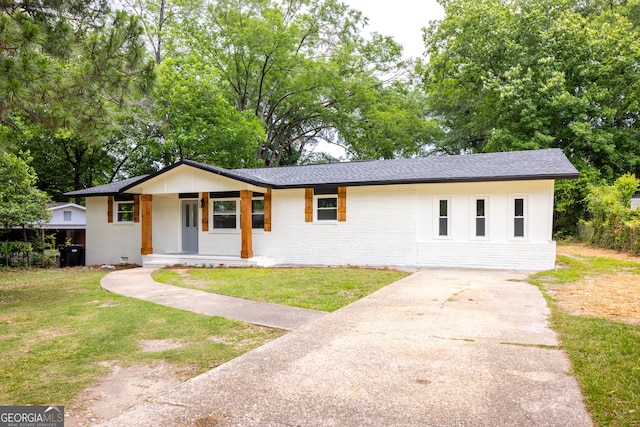 754 Wright Dr, Columbus, GA 31907 - single story home featuring concrete driveway, covered porch, brick siding, and a front yard