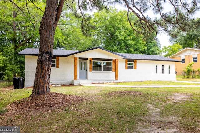 754 Wright Dr, Columbus, GA 31907 - view of front facade with brick siding, a front lawn, and roof with shingles