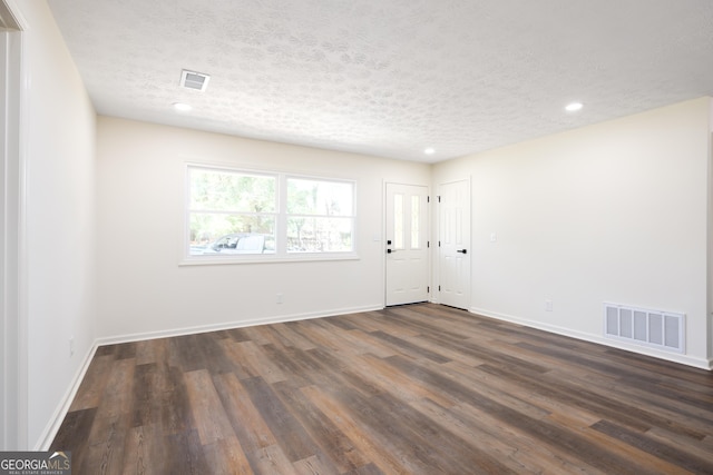 754 Wright Dr, Columbus, GA 31907 - unfurnished room featuring a textured ceiling, dark wood-type flooring, and recessed lighting