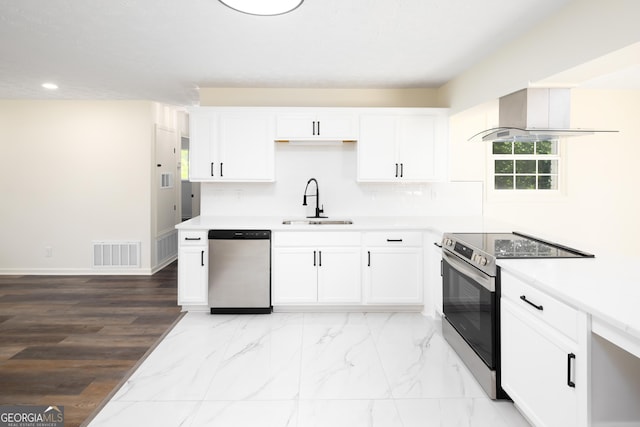 754 Wright Dr, Columbus, GA 31907 - kitchen featuring appliances with stainless steel finishes, recessed lighting, white cabinetry, light countertops, and light marble finish flooring