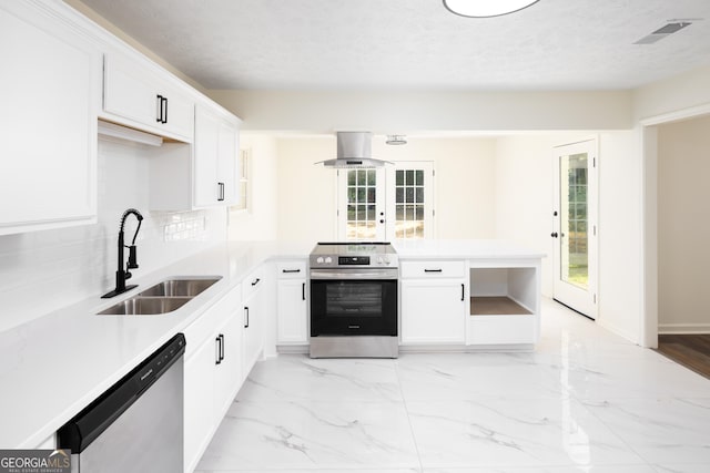 754 Wright Dr, Columbus, GA 31907 - kitchen featuring appliances with stainless steel finishes, island range hood, light countertops, light marble finish flooring, and a textured ceiling