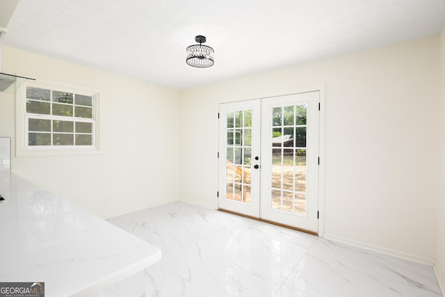 754 Wright Dr, Columbus, GA 31907 - unfurnished dining area with french doors and marble finish flooring